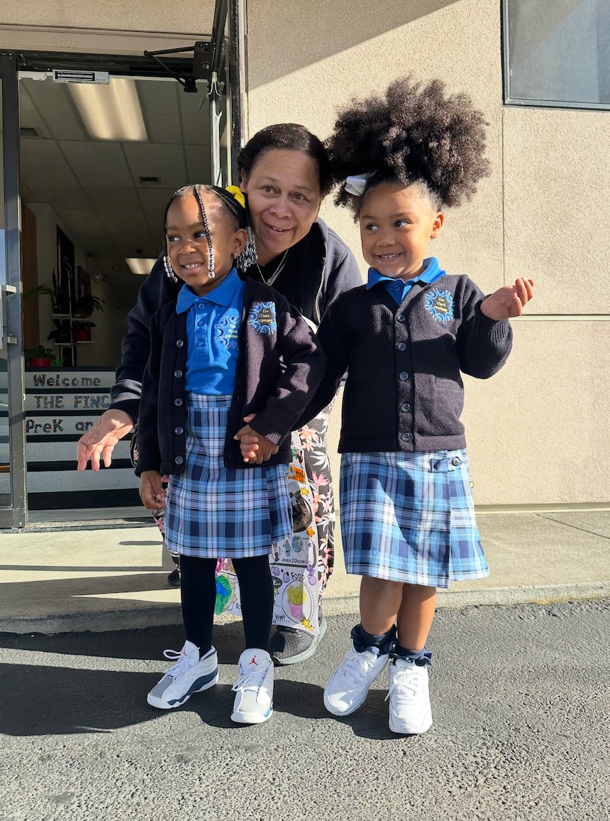 Students at school entrance with teacher